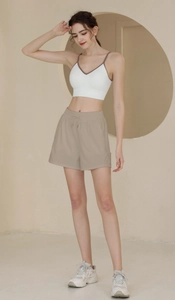 Relaxed fit nylon sports shorts with adjustable drawstring and a stylish white sports tank top