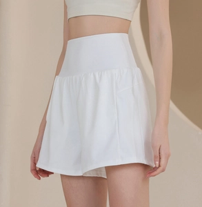 Detail of high-waisted white nylon sports shorts with wide waistband for fitness and yoga