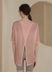 Women's pink tencel sports top featuring a breathable open back split design for yoga