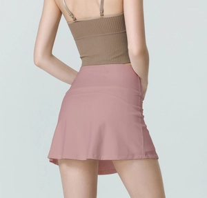 Back view of high waisted rose pink athletic skirt with built-in shorts for running