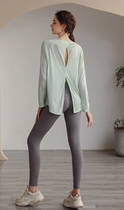 Deep back slit yoga top with high-waisted leggings showing breathable mesh texture