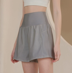 Detail of high waisted grey sports shorts showing side pocket and smooth elastic fabric