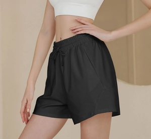 Detail of high waist drawstring athletic shorts in black with side pocket for running