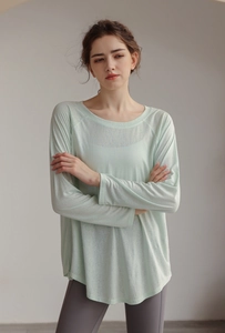 Lightweight mint green tencel yoga long sleeve with breathable mesh texture and curved hem