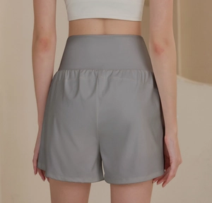 Rear view of high-waisted grey sports shorts showing ergonomic fit and wide waistband