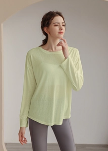 Close-up of lightweight semi-transparent Tencel yoga top fabric and loose fit drop shoulder