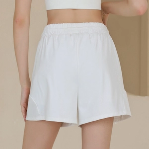 White high-waisted nylon sports shorts with elastic waistband and side stitching