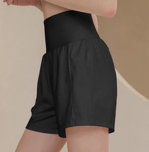 Side view of high-waist nylon sports shorts for women with wide elastic waistband