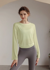 Close-up of lightweight light green long sleeve yoga cover-up with a soft breathable texture