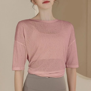 Pink translucent mesh yoga top with loose fit and stylish twist knot hem for women