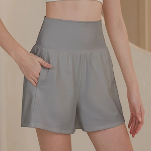 Women's gray high-waisted athletic shorts with side pockets for yoga and running