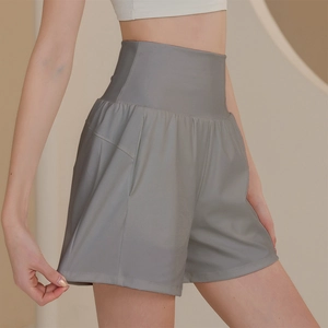 Women's gray high-waisted nylon sports shorts with side pockets for running and yoga