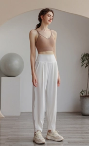 Women's brown V-neck rib-knit sports vest and white high-waist joggers outfit
