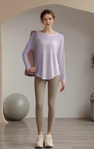 Close-up of lightweight purple yoga cover-up with high-waist leggings and a yoga mat