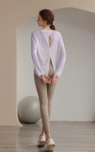 Detail of lavender yoga top featuring a breathable open-back slit and loose fit design