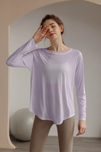 Close-up of lightweight lavender tencel yoga shirt fabric with breathable textured knit