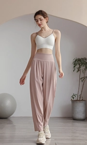 High-waist purple joggers and white ribbed sports bra set for yoga and fitness