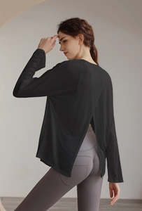 Detail view of women's workout top featuring a stylish back slit design for breathability