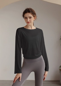 Close-up of lightweight black yoga cover up with high waist grey fitness leggings
