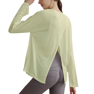 Women's pale yellow long sleeve yoga top with back cross split and mesh fabric texture