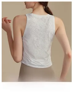 Macro view showing the breathable jacquard texture of the white yoga tank top