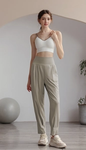 Women's high waist yoga set with white sports top and light green wide leg pants