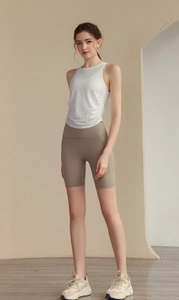 Detail of white jacquard yoga tank top with breathable mesh texture and slim fit design