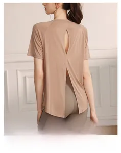 Detail view of the breathable split back design on this beige tencel yoga sports top