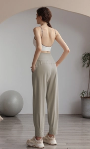 Back view of high-waisted nylon joggers showing the elastic waistband and relaxed fit