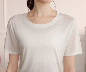 Detail of white yoga t-shirt with breathable fabric texture and classic round neck design