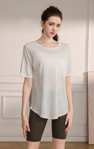 Detail of breathable light grey semi-transparent yoga t-shirt fabric and curved hem design