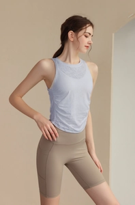 Detail of lavender burnout jacquard yoga vest with breathable textured fabric pattern