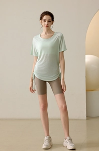 Close-up of lightweight mint green yoga t-shirt with adjustable side drawstrings