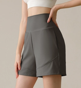 Close-up of high-waisted charcoal grey athletic shorts with curved seam stitching detail