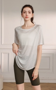 Detailed macro view of breathable lightweight mesh fabric on a grey yoga top