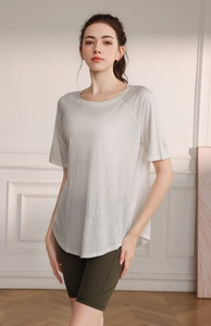 Close-up of lightweight breathable white T-shirt fabric with semi-transparent texture
