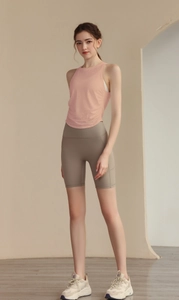 Detail of slim-fit jacquard yoga vest showing side ruched design and smooth fabric texture