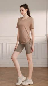 Short sleeve yoga top with side drawstring detail and loose fit workout T-shirt