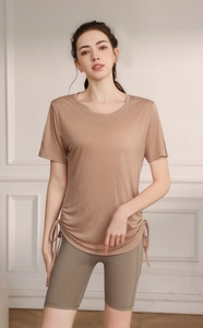 Macro detail of breathable Tencel yoga top with drawstring side hem and matching shorts
