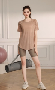 Detail view of the breathable tencel fabric and side slit design on the yoga top