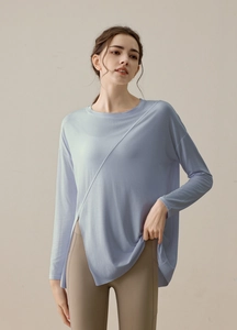 Detail of light blue long sleeve yoga top with side slit and soft breathable fabric