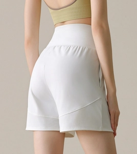 Detail of high-waist white nylon sports shorts featuring slimming diagonal seam stitching