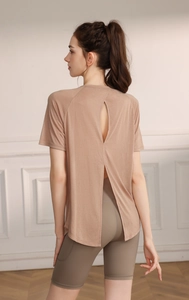 Detail view of the open-back breathable design on this earthy beige yoga t-shirt