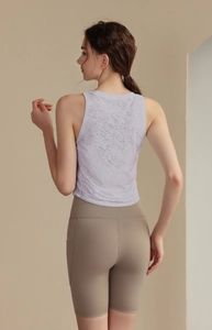 Close-up of lightweight jacquard texture on sleeveless lavender yoga top for women