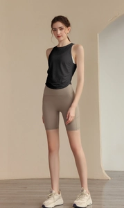 Detailed close-up of a slim-fit jacquard yoga vest with high-waisted gym shorts