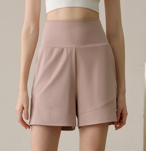 Detail of high-waisted nylon sports shorts with curved stitching and smooth fabric texture