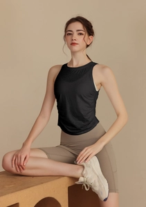 Detail of black seamless jacquard yoga vest showing breathable mesh texture and fabric