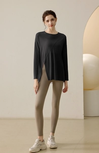 Full view of women's modal yoga top with side slit and khaki fitness leggings set