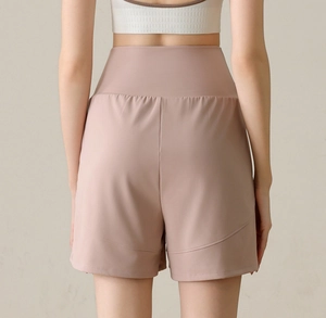 Close-up of high-waist women's nylon sports shorts with curved stitching and back seams