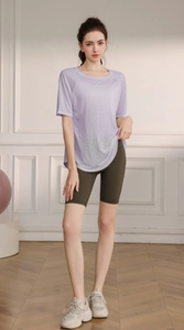 Detailed close-up of light purple moisture-wicking yoga top with breathable snowflake fabric